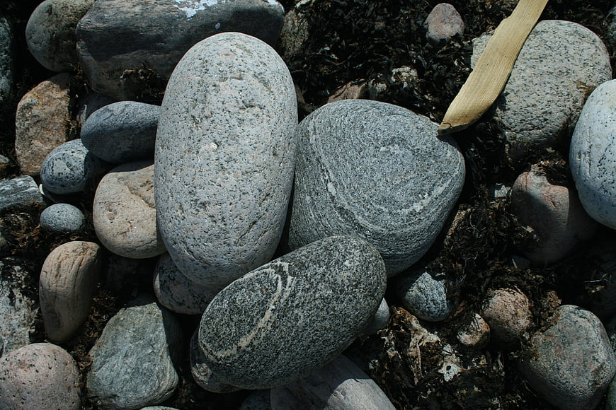 Close-up of smooth gray beach stones and pebbles