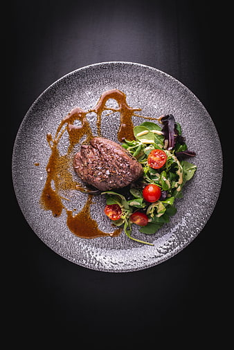 Gourmet Beef Steak With Fresh Salad And Sauce On Textured Plate