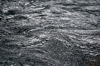 Close-up of rippling dark water surface texture