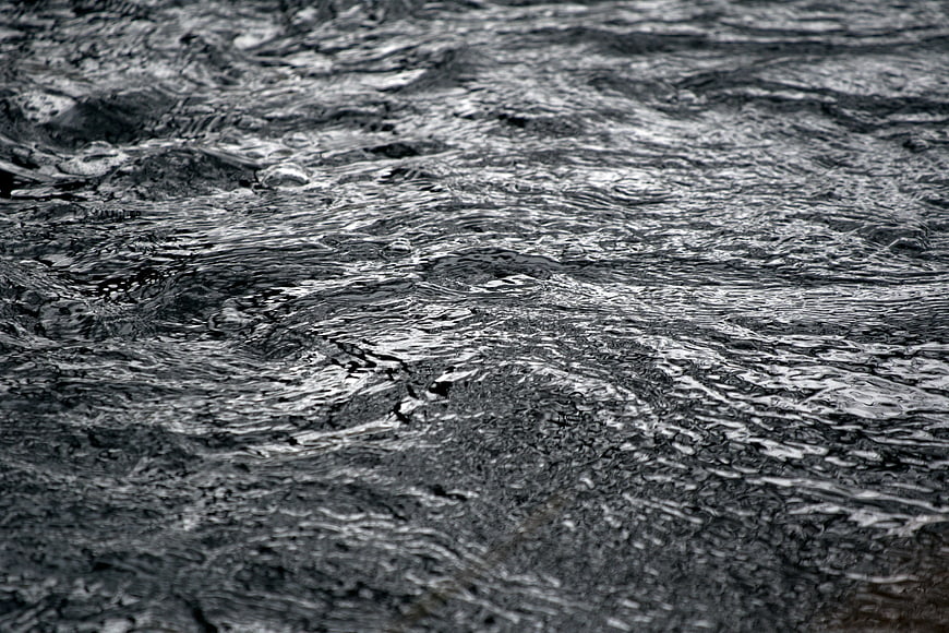 Close-up of rippling dark water surface texture