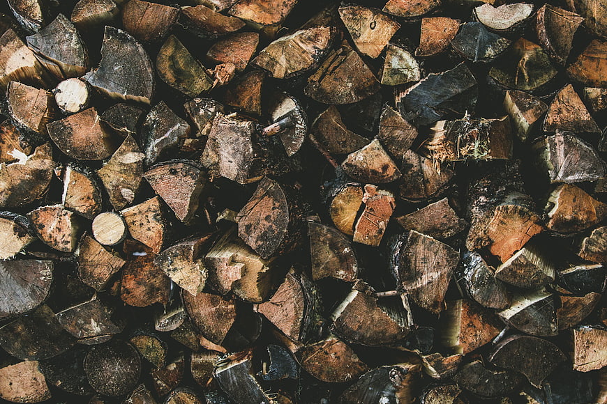 Stacked Firewood Logs Texture Background