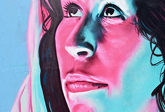 Vibrant Pink and Blue Street Art Mural of a Woman's Face