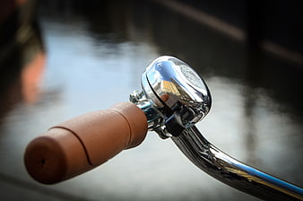 Close-up of vintage bicycle bell on handlebar