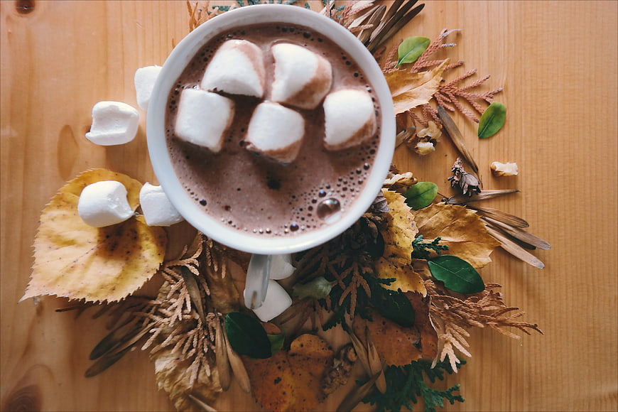 Overhead View of Hot Chocolate with Marshmallows on Wooden Table