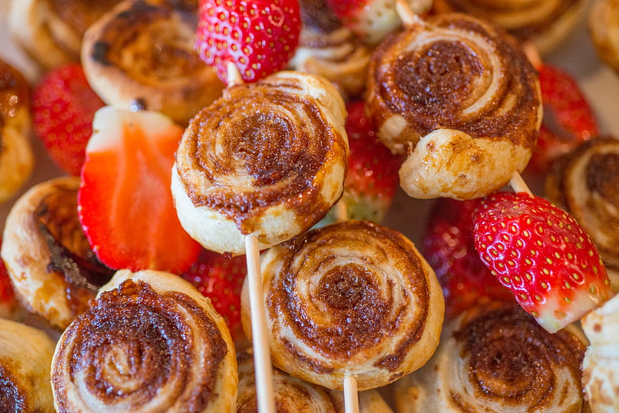 Mini cinnamon rolls and strawberries on skewers