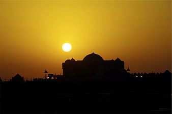 Silhouette of Mughal Architecture Against Golden Sunset Sky