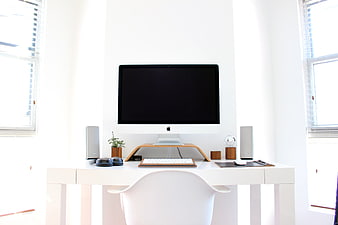 Minimalist White Home Office Workspace With Apple iMac And Modern Desk Setup
