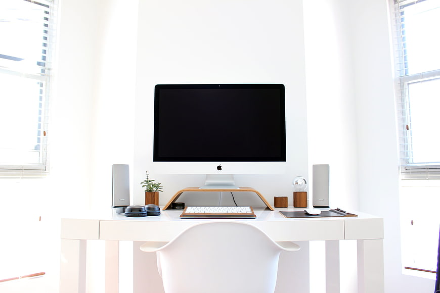 Minimalist White Home Office Workspace With Apple iMac And Modern Desk Setup