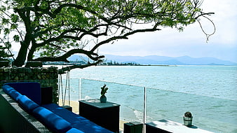 Luxury Blue Sofa on Balcony Overlooking Ocean View