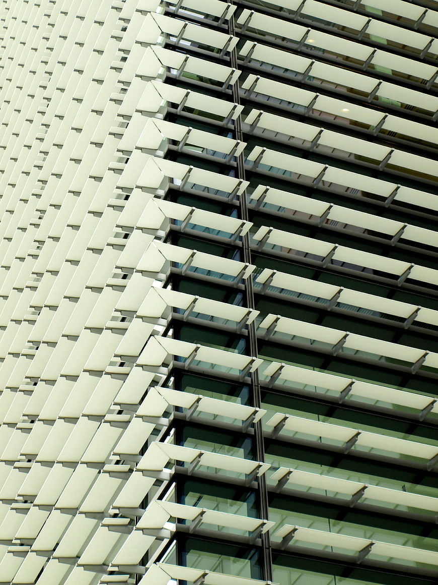 Modern Building Facade with Geometric White Louvers