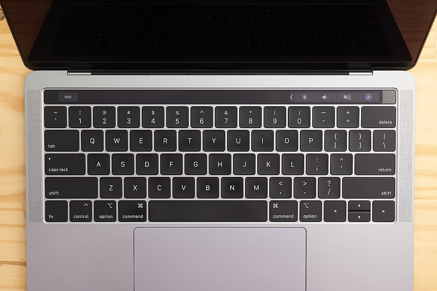 Top View of MacBook Keyboard on Wooden Desk
