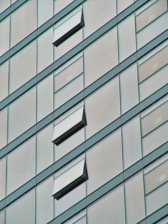 Modern glass office building facade with open windows