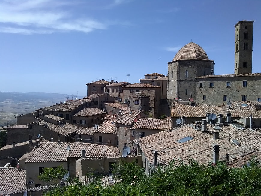 Historic Italian hilltop town with terracotta roofs and church dome
