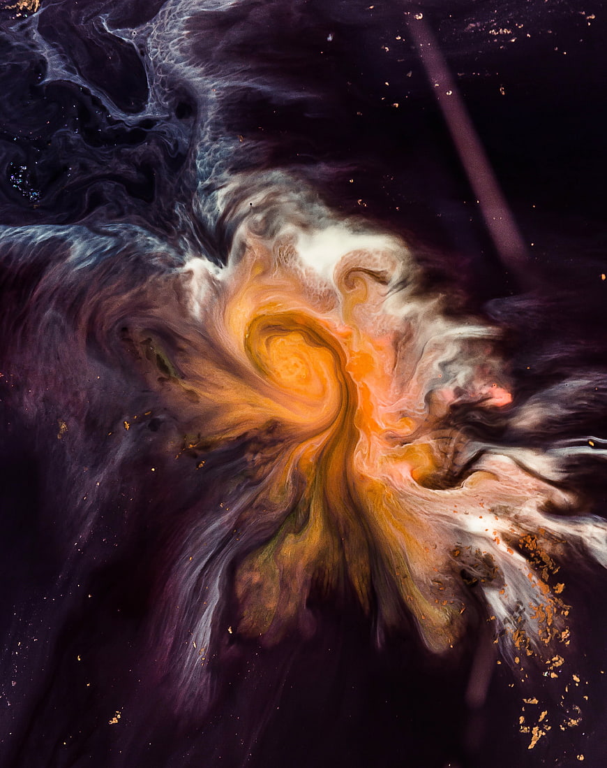 Abstract fluid art with swirling orange, gold, and dark purple ink