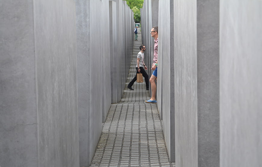 Tourists Walking Through Concrete Slabs at Holocaust Memorial