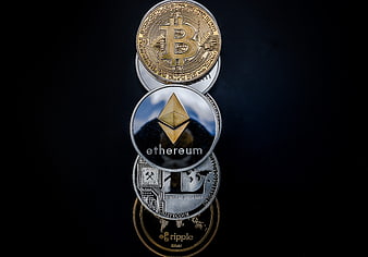 Stack of Physical Cryptocurrency Coins on Black Background