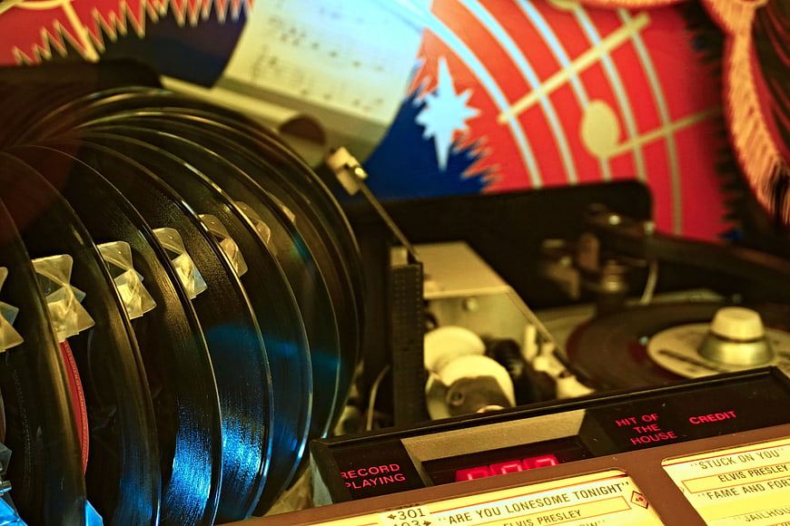 Close-up of vintage jukebox with vinyl records and Elvis Presley song list
