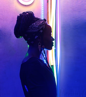 Woman in Profile with Neon Lights and Braided Hair