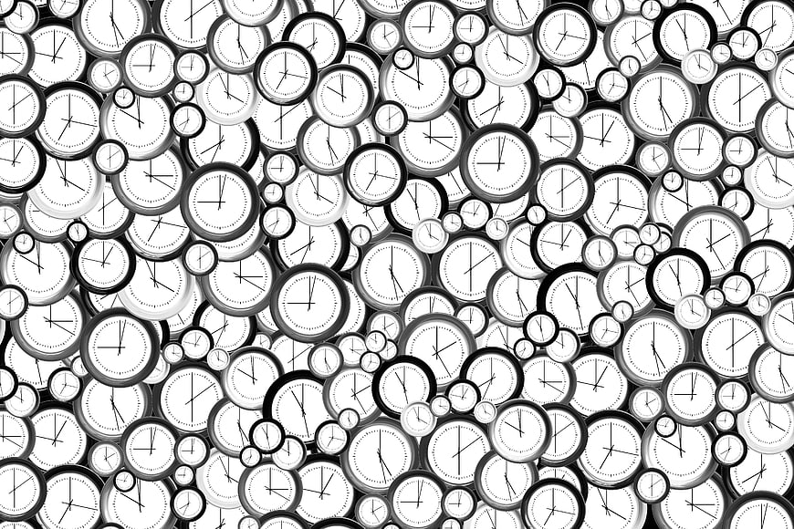 Black and white seamless pattern of overlapping analog clocks