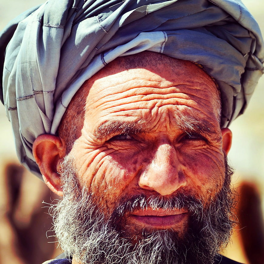 Close-up portrait of elderly man with turban and beard