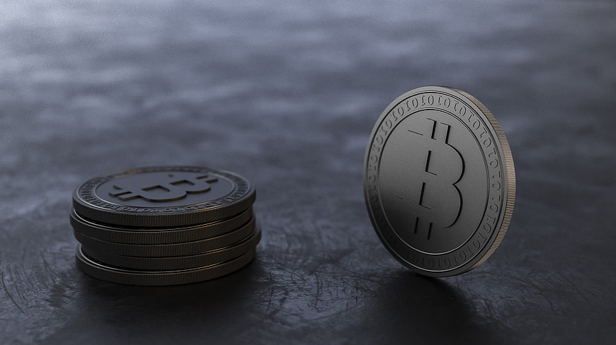Bitcoin Coins on Dark Textured Surface