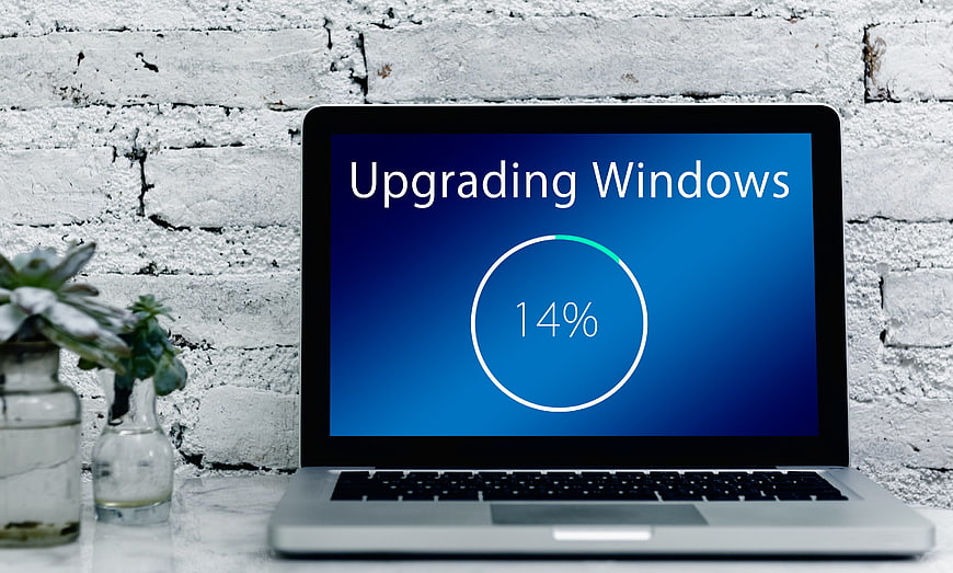 Laptop Displaying Windows Operating System Upgrade Progress Screen