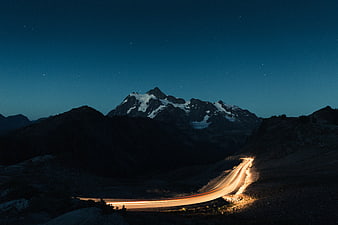 Long Exposure Mountain Road at Night with Starry Sky