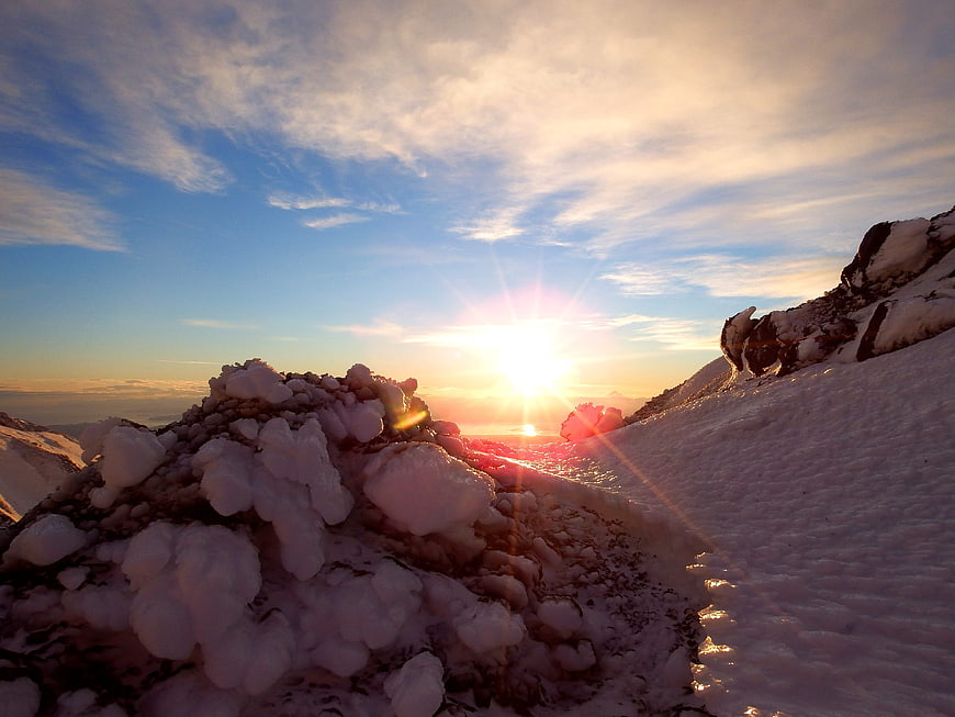 Sunset over Snowy Mountain Ridge in Kamchatka
