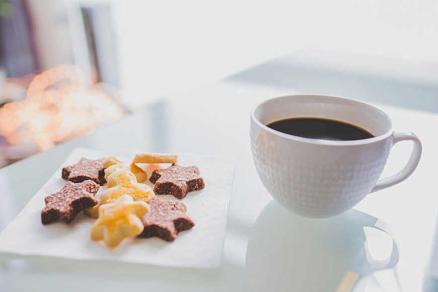Star Shaped Cookies and Coffee Cup on White Table