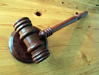 Wooden Judge Gavel and Sound Block on Pine Table
