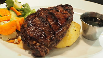 Grilled Steak Dinner With Mashed Potatoes And Mixed Vegetables