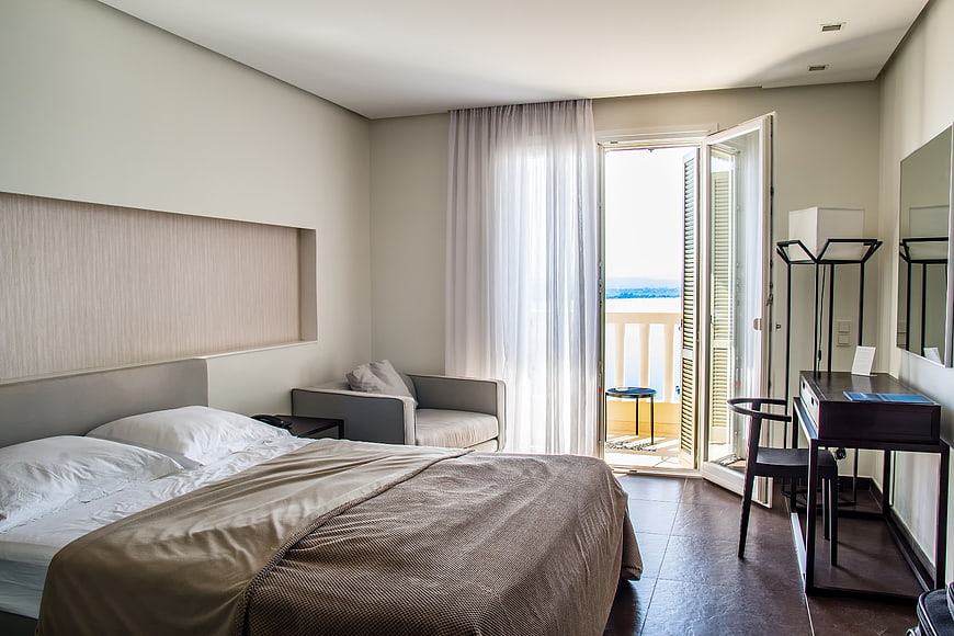 Modern Hotel Bedroom with Balcony and Sea View