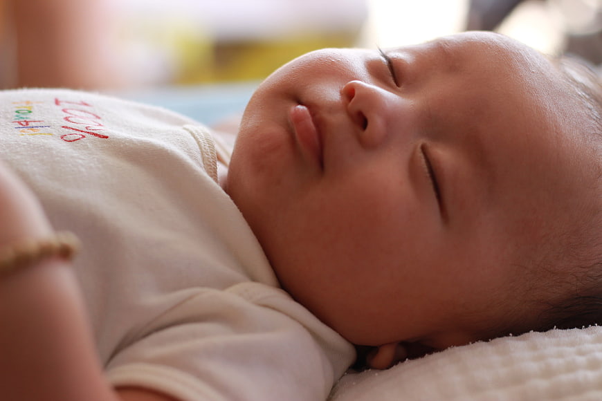 Sleeping newborn baby close up portrait