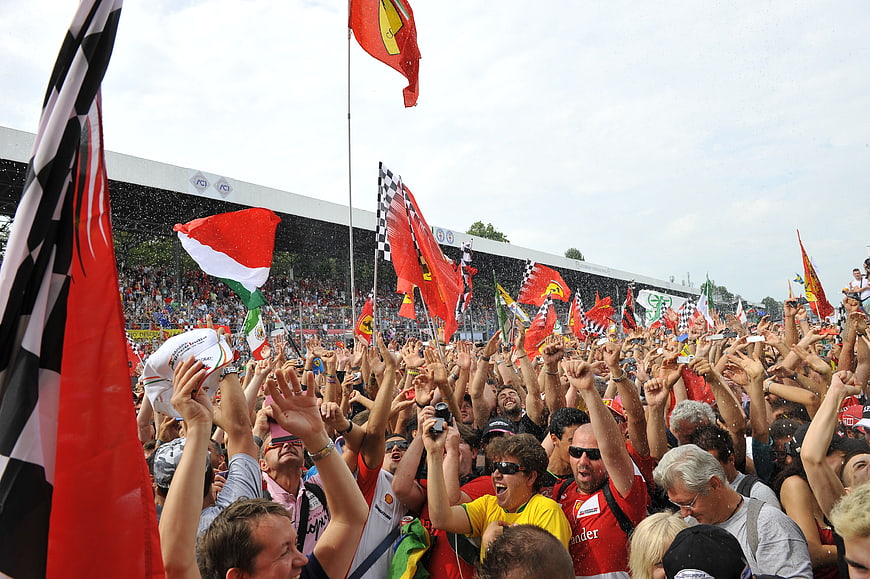 Ferrari Fans Celebrating With Flags At Formula 1 Race