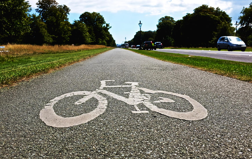 Low angle view of bicycle symbol on paved cycle path