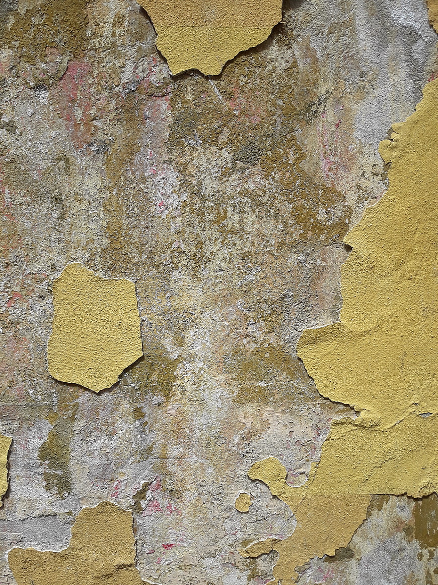 Textured Old Wall with Peeling Yellow Paint Background
