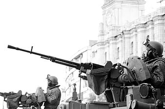 Black and white military soldiers with heavy machine guns