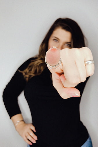 Woman Pointing Finger at Camera with Silver Ring