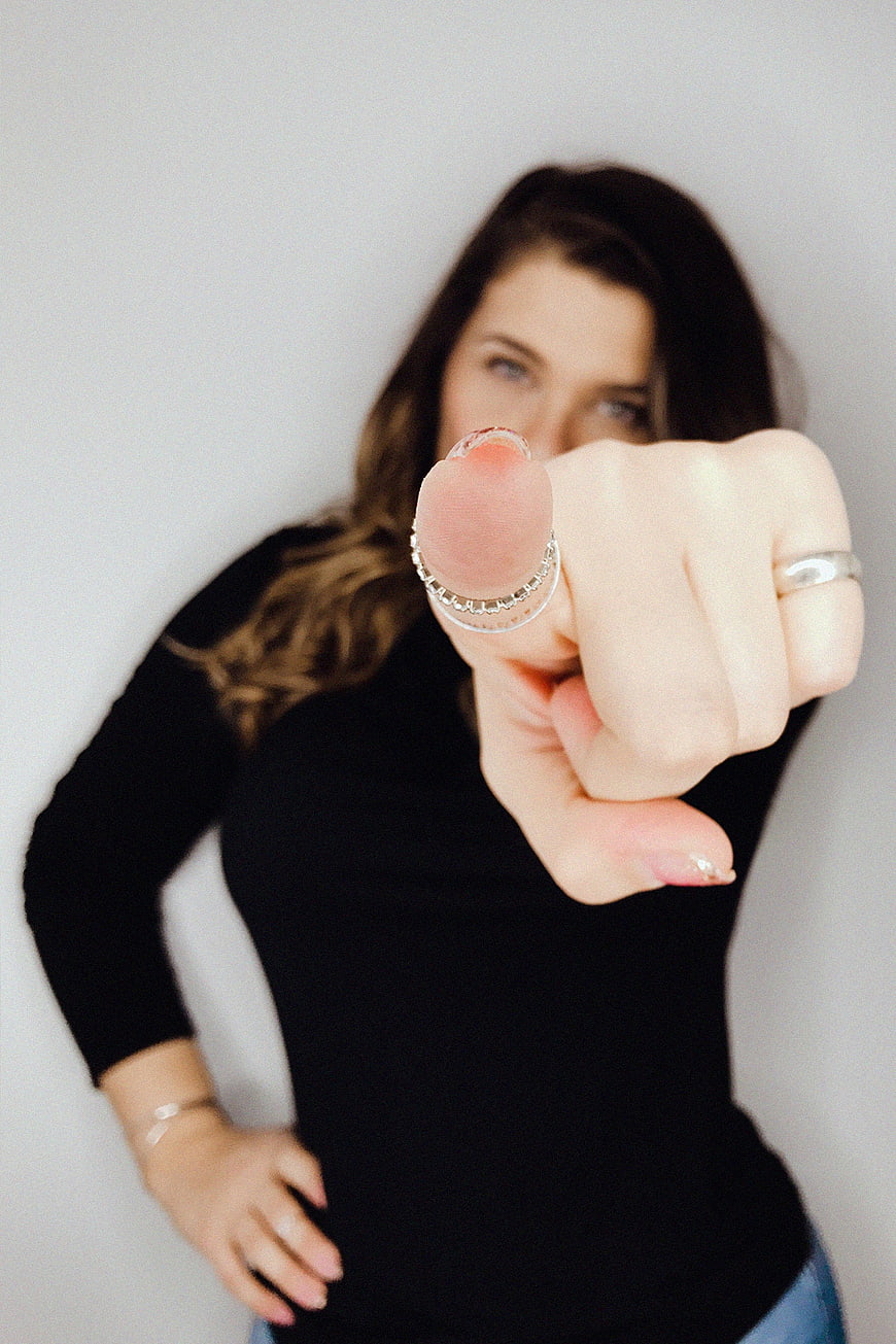 Woman Pointing Finger at Camera with Silver Ring