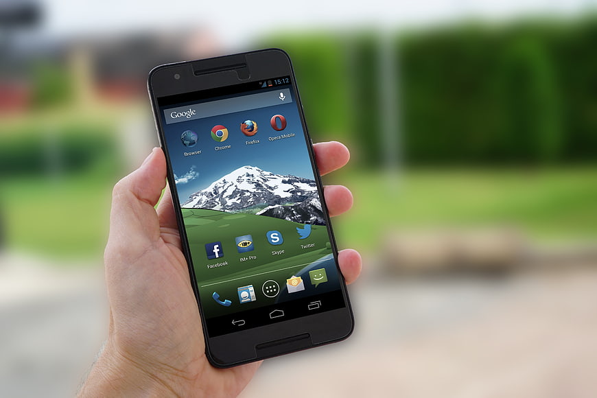 Hand Holding Android Smartphone With App Icons