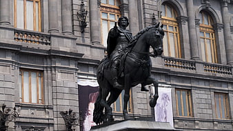 Bronze Equestrian Statue in Front of Historic Building