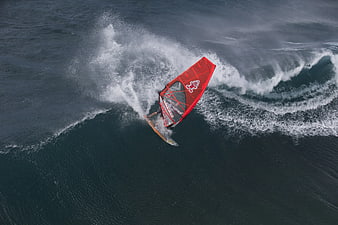 Aerial View of Windsurfer Carving on Ocean Wave