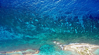 Aerial View of Turquoise Ocean Water and Coral Reef