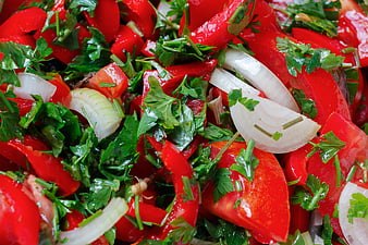 Close-up of fresh red tomato and parsley salad with onion