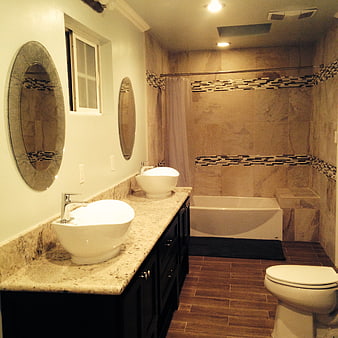 Modern bathroom interior with double vanity and beige tile