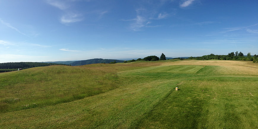 Panoramic View of Rolling Green Hills and Blue Sky