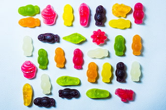 Colorful Gummy Bears and Sweets on White Background