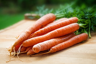 Fresh Organic Carrots on Wooden Cutting Board