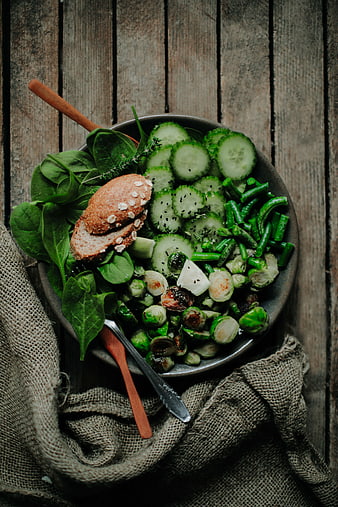 Overhead view of healthy green salad with roasted Brussels sprouts