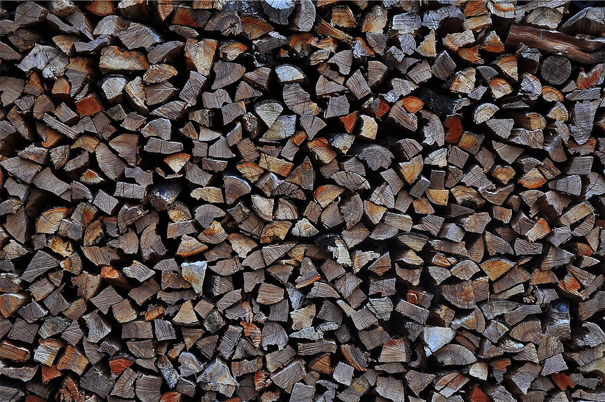 Stacked Firewood Logs Texture Background